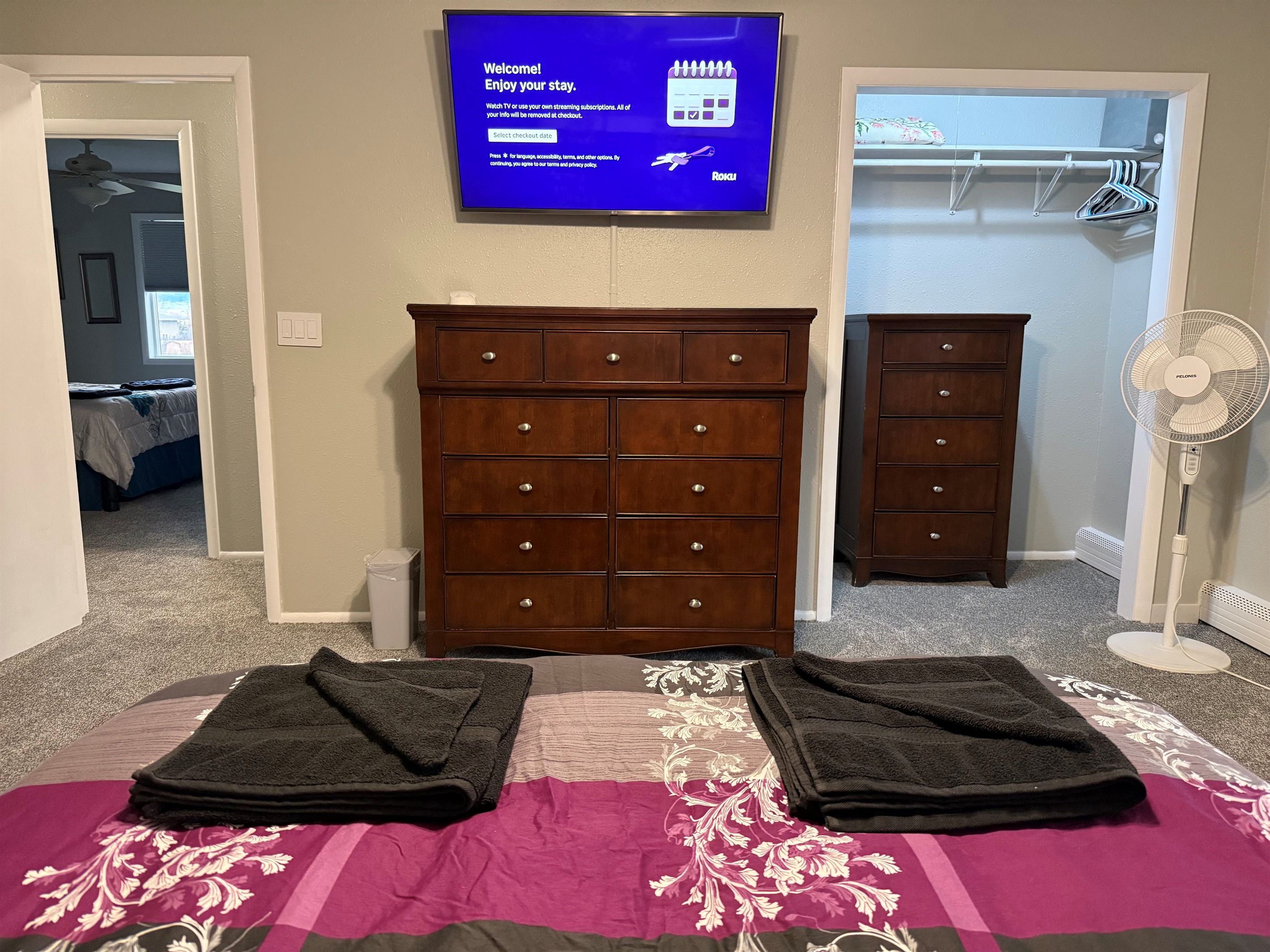 Queen bed with large Roku TV